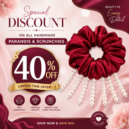 A promotional graphic for a deep red satin scrunchie adorned with dangling white faux pearls, set against a soft pink floral background with sale text and decorative banners.